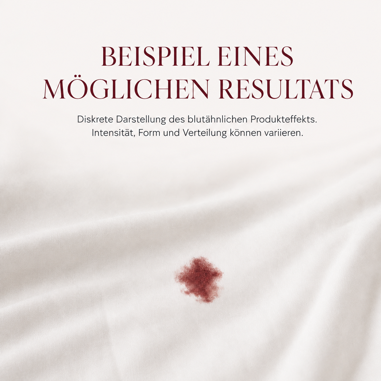 Beispiel eines möglichen blutähnlichen Effekts der VirginiaCare Hymen Blutkapseln auf weißem Stoff